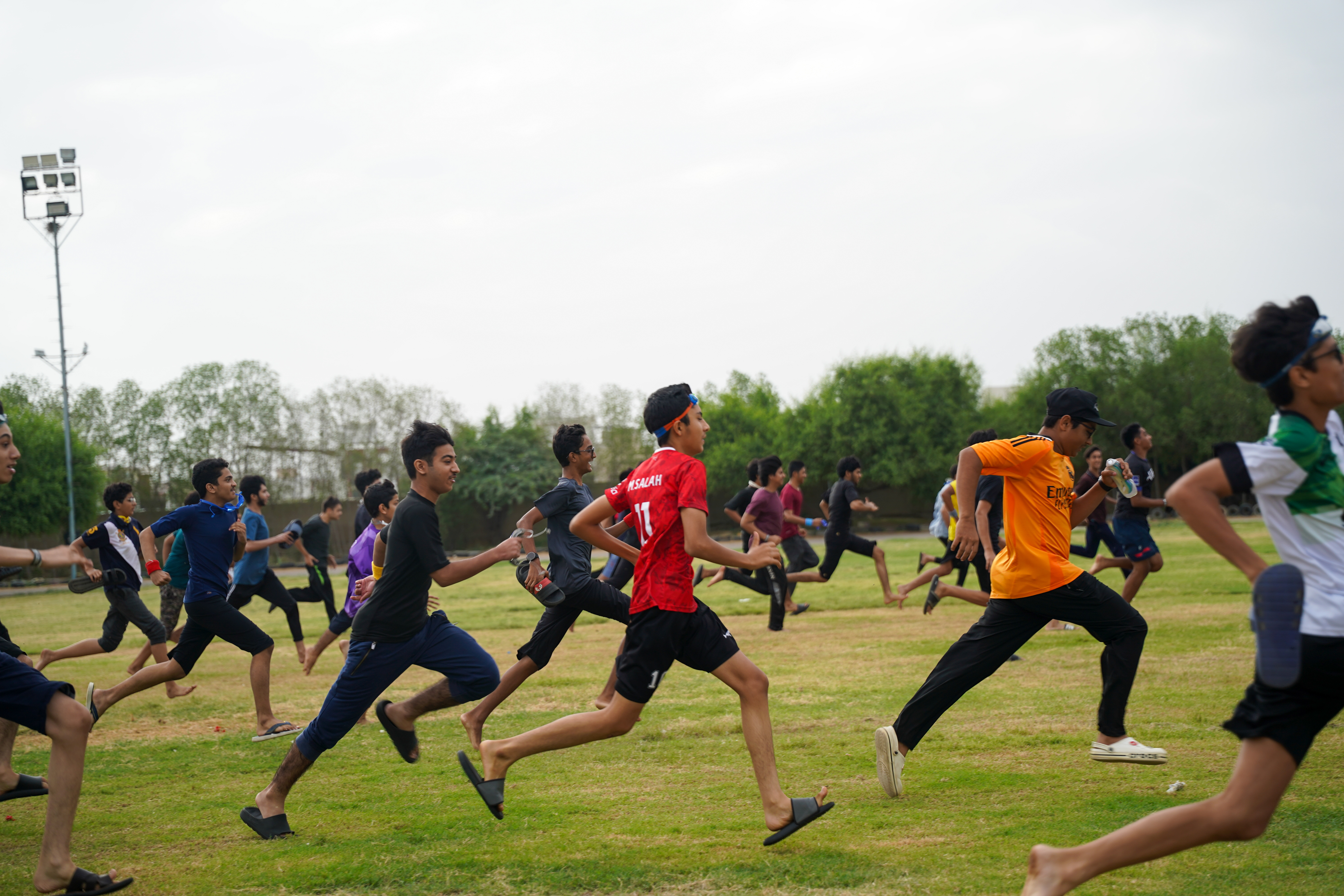 Amazing Race — boys sprinting across the field
