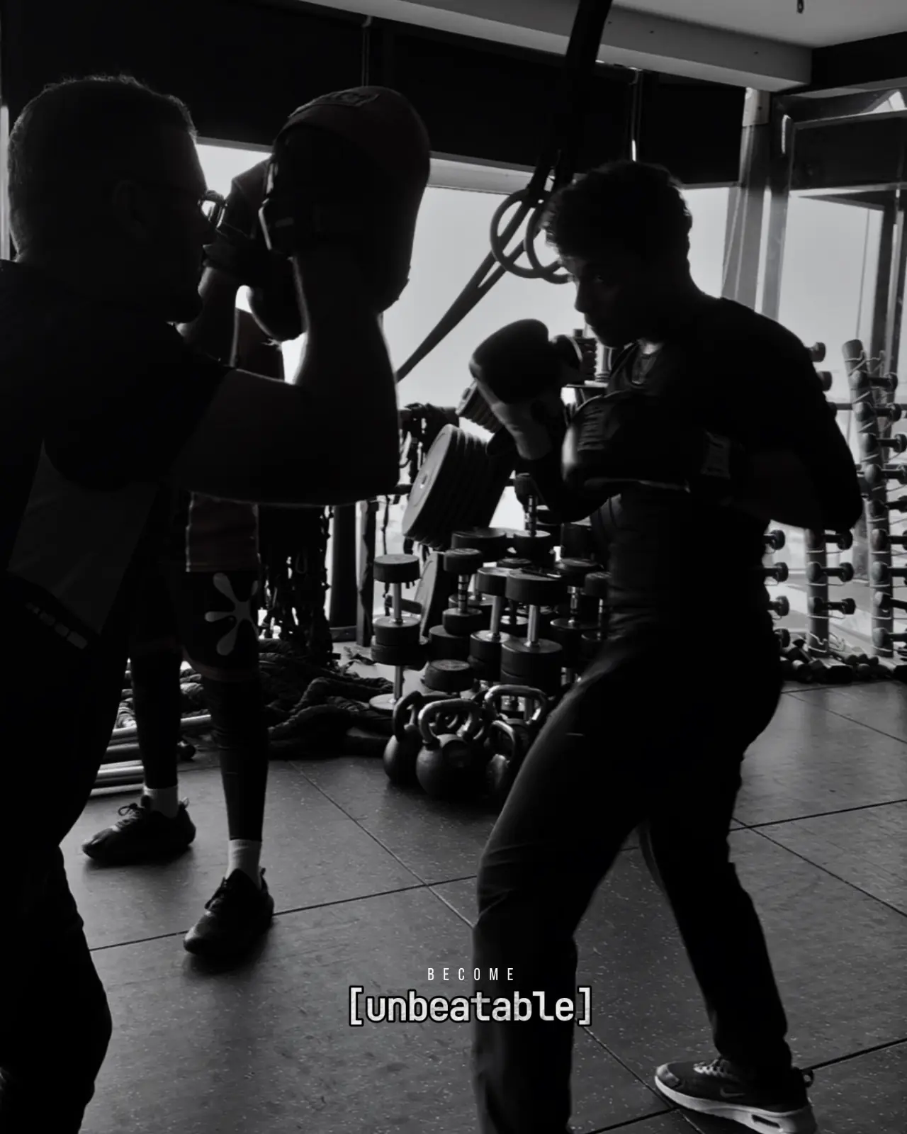 A participant practising a kickboxing mitt drill with a K7 trainer